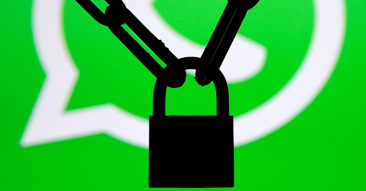 A Photo Illustration Shows A Chain And A Padlock In Front Of A Displayed Whatsapp Logo