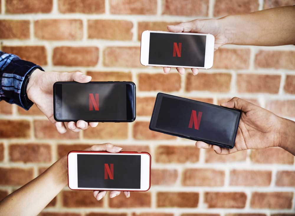 People Watching Netflix On Phones
